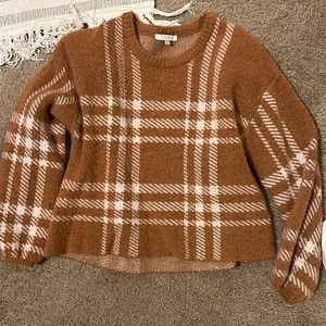 Cropped (to the belt line) patterned sweater.